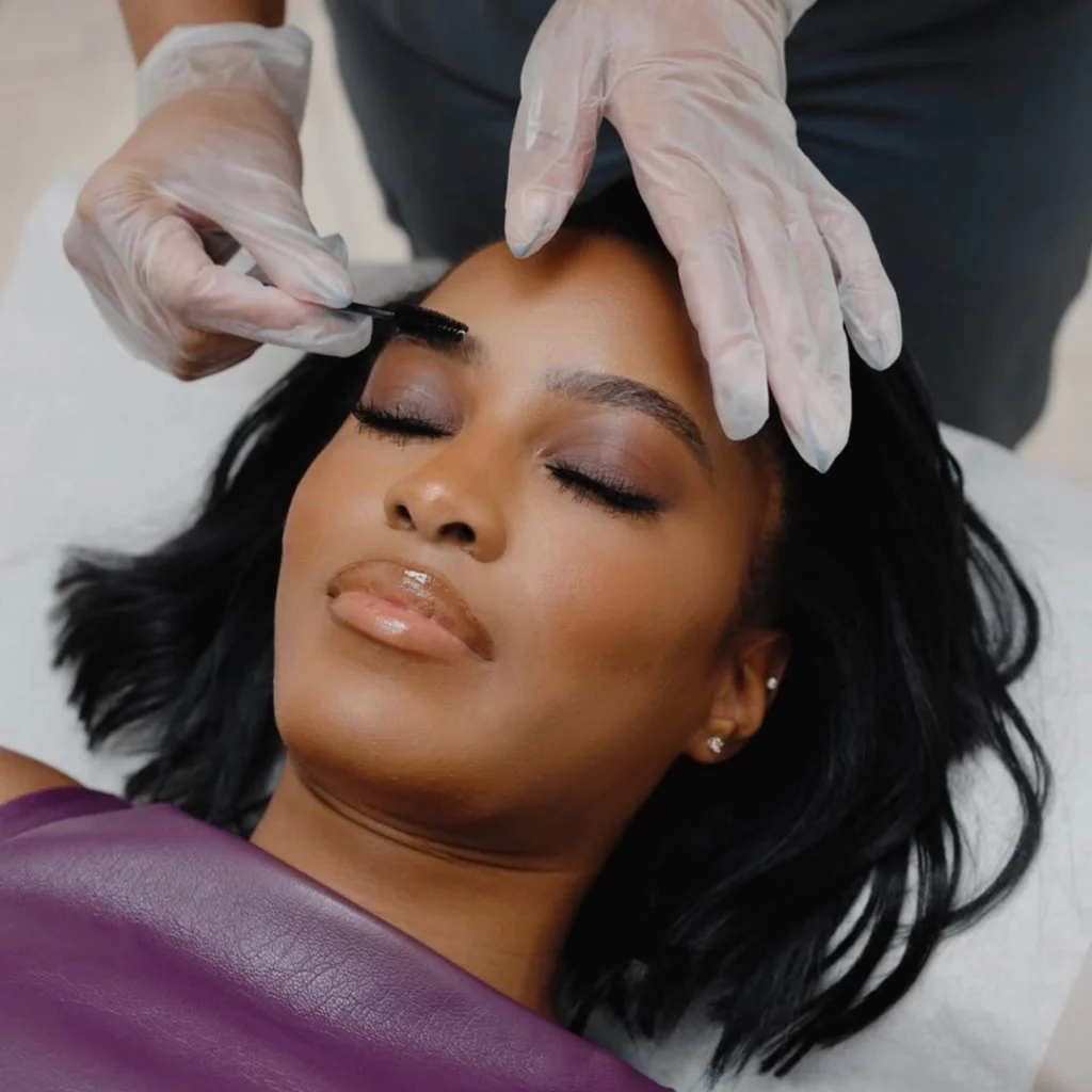 Woman has her eyebrows styled at European Wax Center.