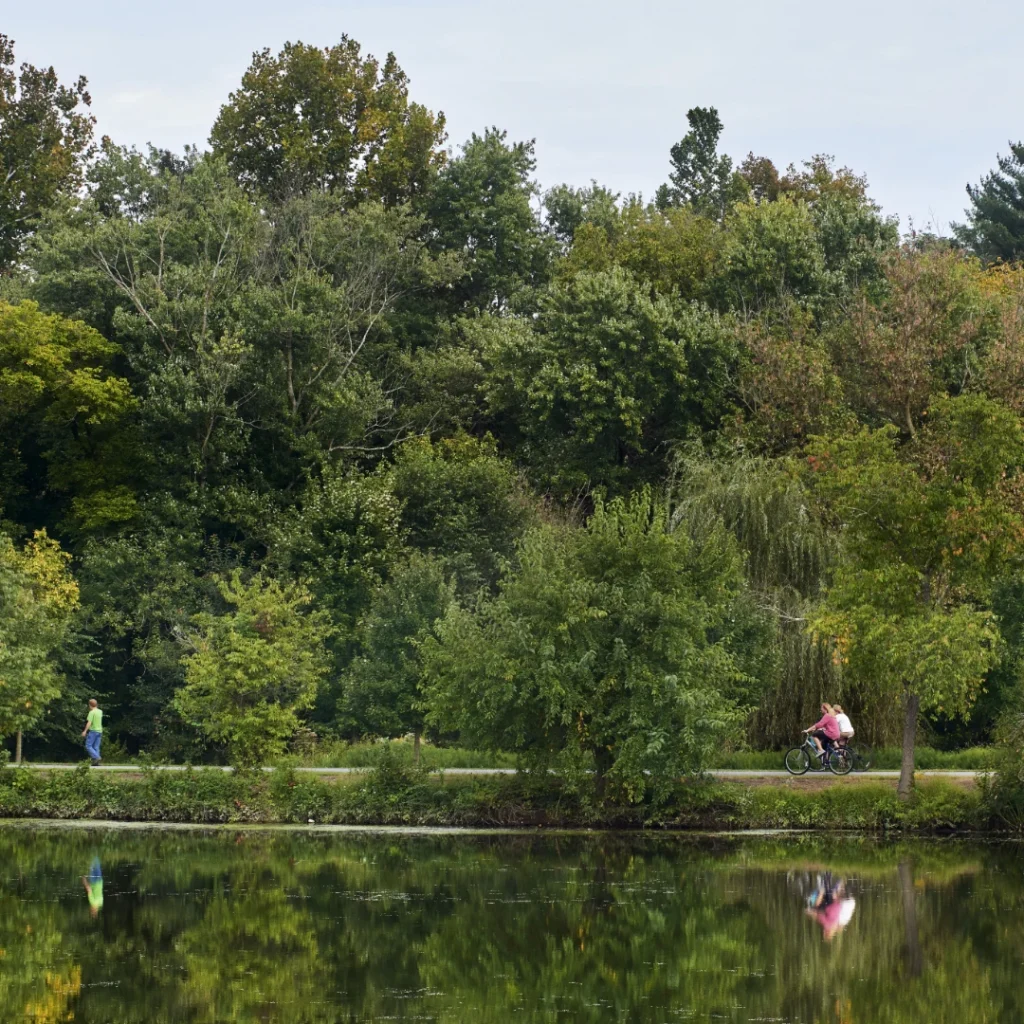 People bike along the Lake Kittamaquandi Trail.
