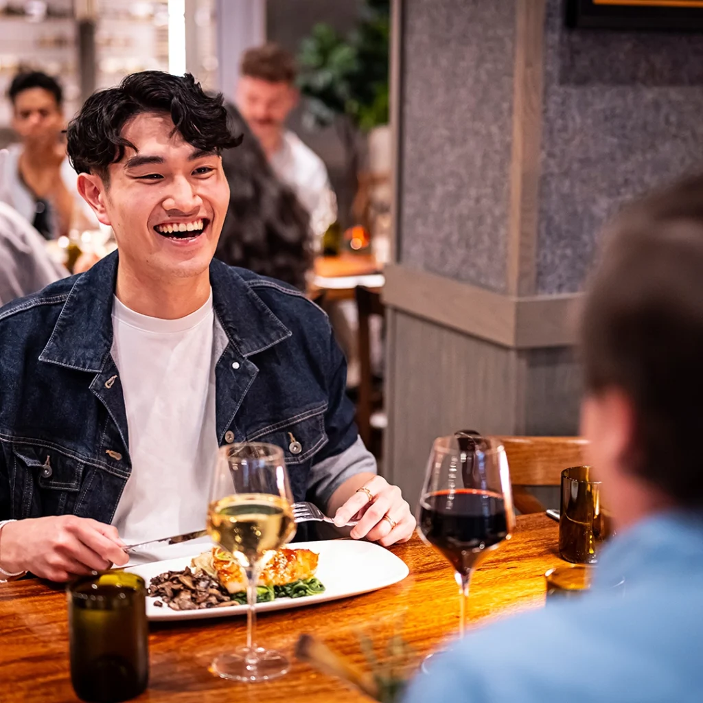 Person and company dine at Smashing Grapes.