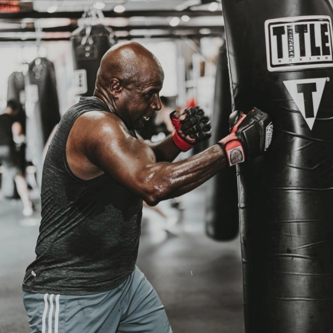 Man boxes at Title Boxing Club.