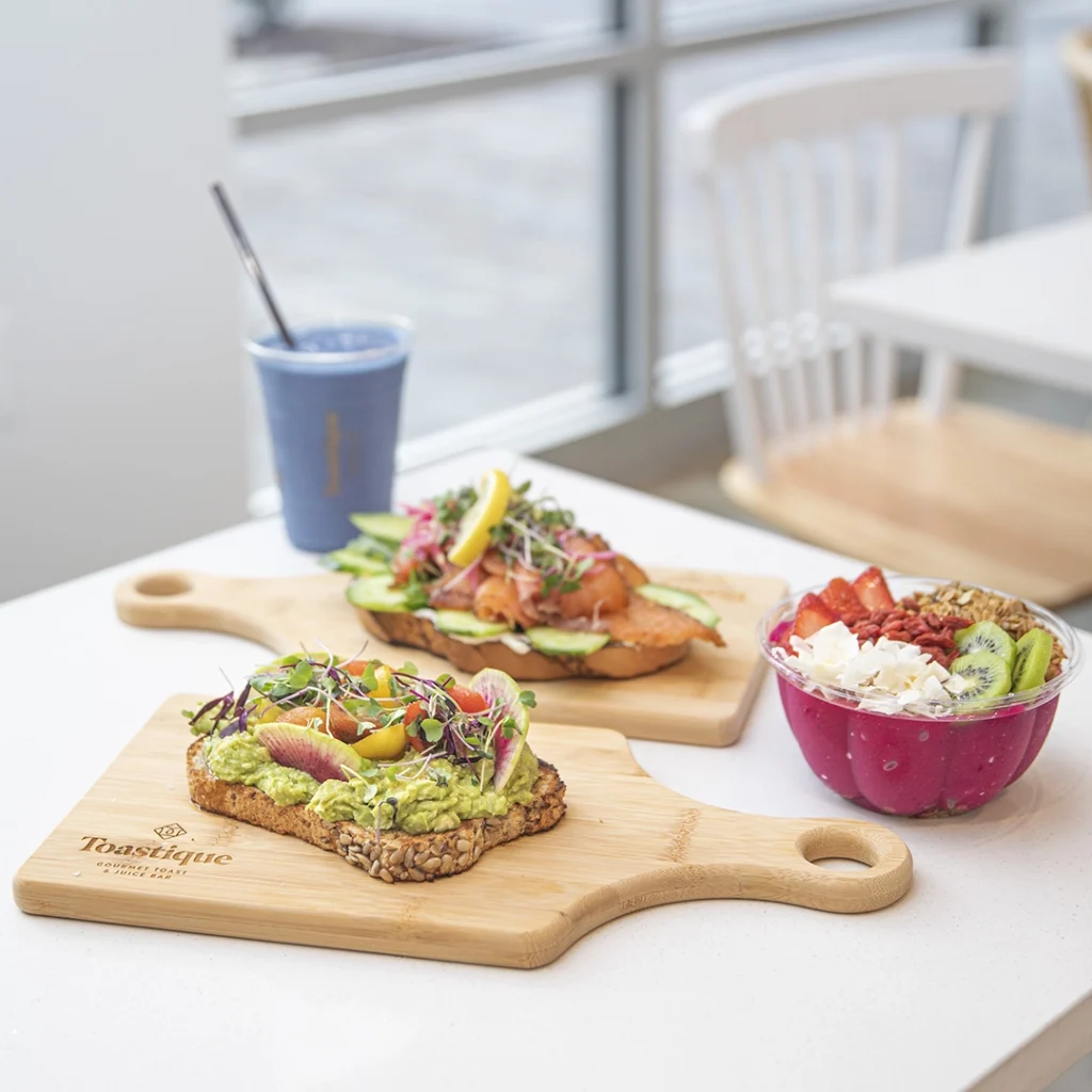 Toastique toasts, smoothie, and healthy bowls in a restaurant.