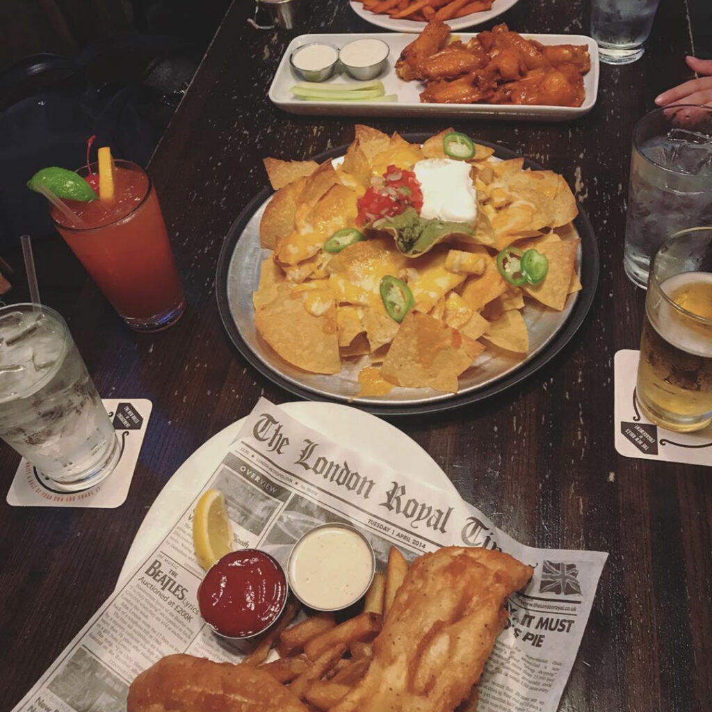 Union Jack's plates of nachos, fish and chips, and wings.