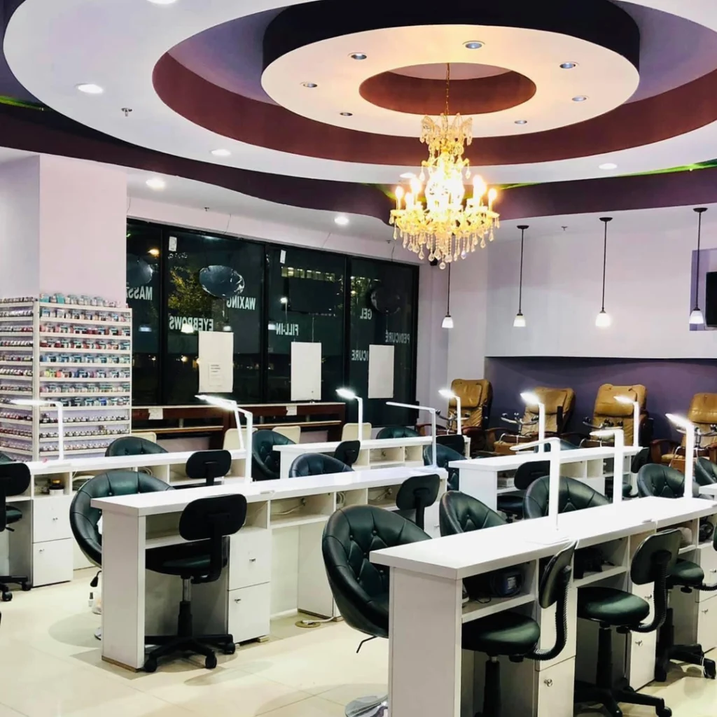 Inside Village Nail Bar with tables for treatment.