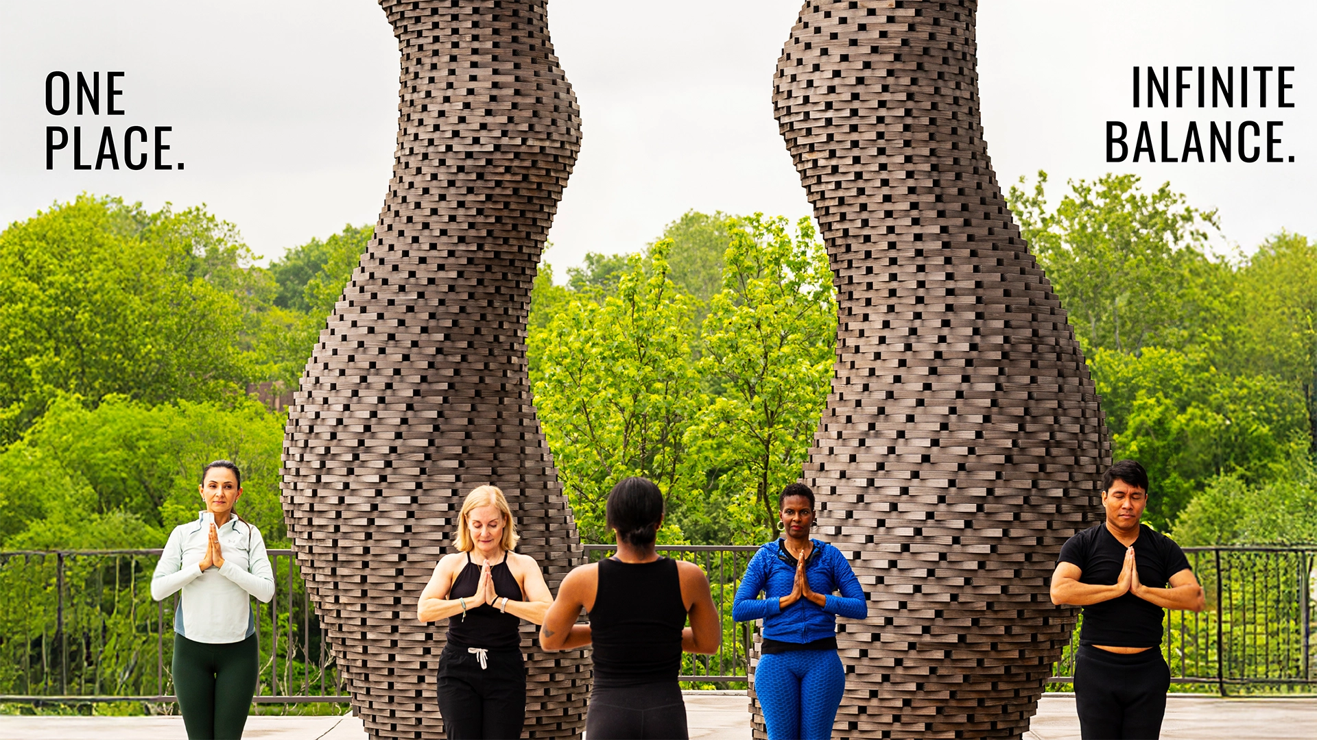 Five people do yoga in front of sculptures. Text reads "One Place. Infinite balance."